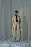 Lorena Saravia Alex wool pants in neutral fabric, tailored fit, featuring classic design and side pockets.