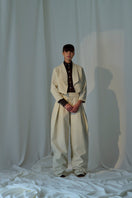 Lorena Saravia ALEX wool pants in neutral fabric, featuring a tailored fit and classic design, displayed on a mannequin.
