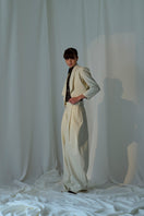 Lorena Saravia Alex wool pants in neutral fabric, tailored fit, front pockets, and wide-leg design, perfect for stylish office wear.