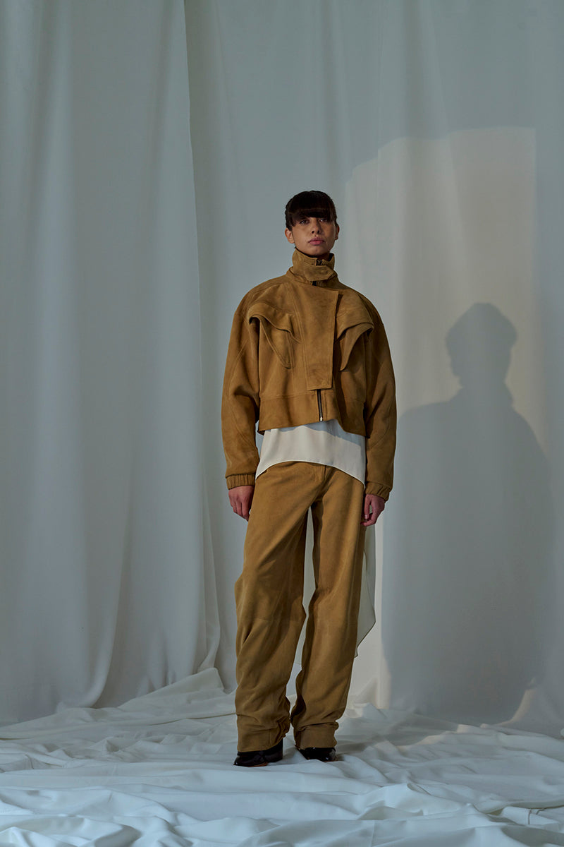 Lorena Saravia Julia suede pants in a soft, stylish design, featuring a tailored fit and smooth fabric in a neutral color.