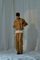 Lorena Saravia Julia suede pants in a soft beige color, featuring a relaxed fit and stylish design.