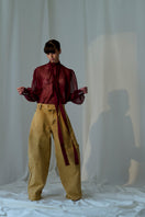 Lorena Saravia ALEX brown pants showing a tailored fit and stylish design on a neutral background.