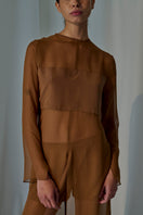 Lorena Saravia Tina Shorts in beige displayed on a model, featuring a casual fit and stylish design.