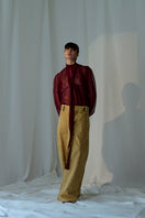 Lorena Saravia Alex Brown Pants displayed on a model, featuring a stylish fit and tailored design in rich brown fabric.