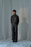 Lorena Saravia Julia Pants in neutral fabric, tailored slim-fit design with side pockets and belt loops, front view.