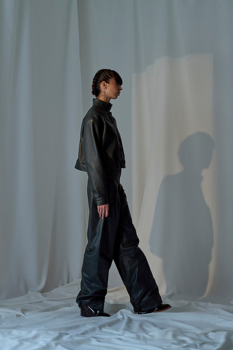 Lorena Saravia Julia Jacket in neutral fabric, front view with collar and zip closure, stylish women's outerwear.