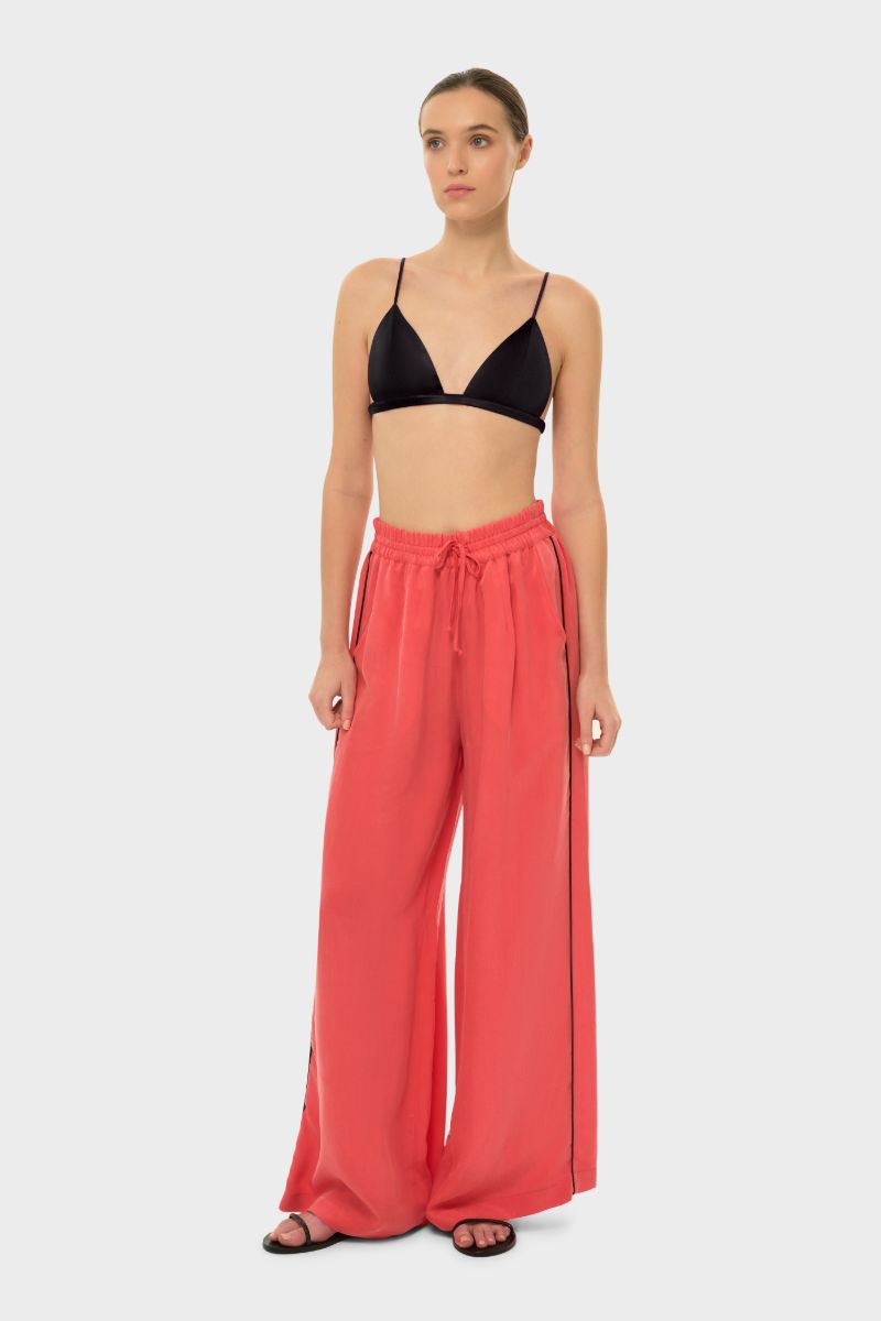 niLuu AquaFlora lounge pants in coral, soft and comfortable casual pants with a relaxed fit, shown on a model.