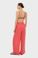 niLuu AQUAFLORA lounge pants in coral, stylish and comfortable pants with a relaxed fit, shown on a model.