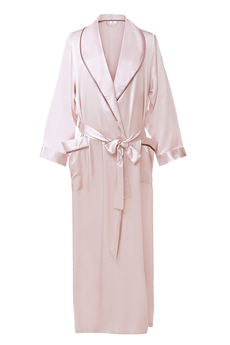 Pink silk long women's robe by MANITO, featuring smooth fabric and elegant design, displayed hanging on a wooden hanger.
