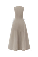 Beige sleeveless poly crepe midi flared gown by L'SCARLETT, featuring a sleek, flowing silhouette and elegant design.
