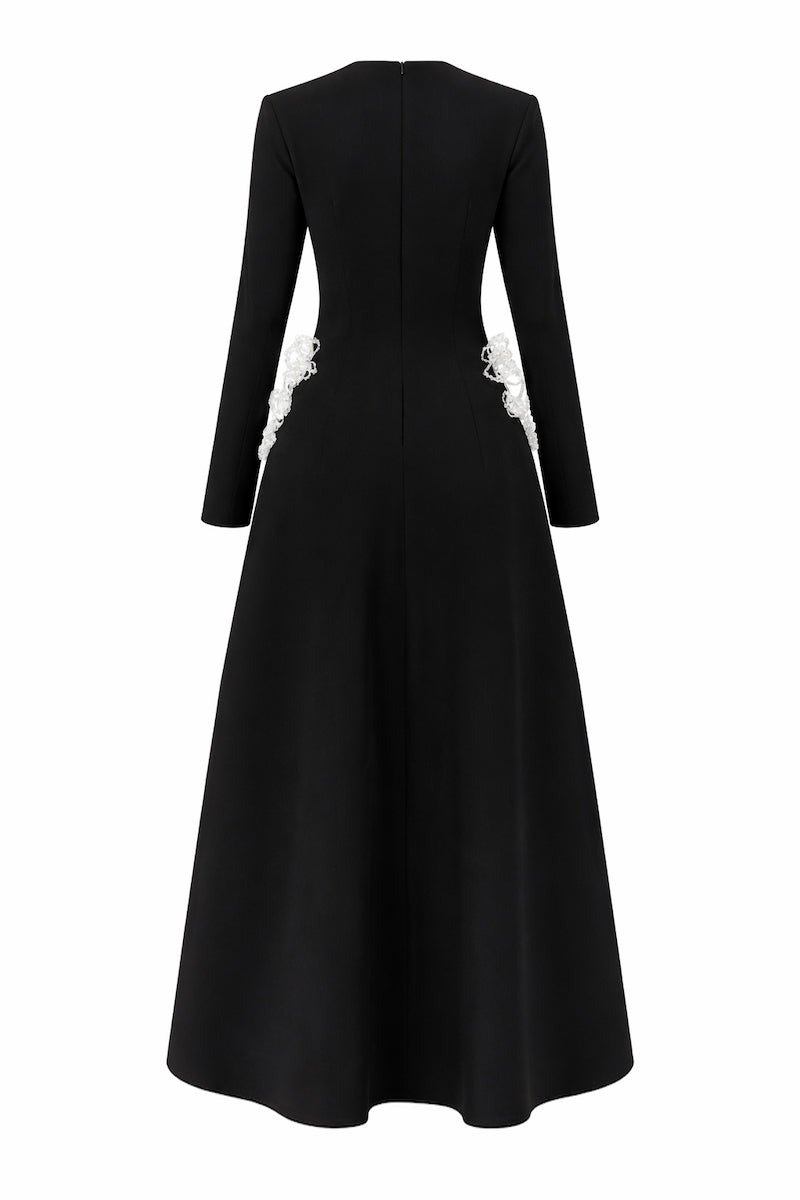 Black L'SCARLETT flared long-sleeve maxi dress with 3D crystal floral design, shown from the back.