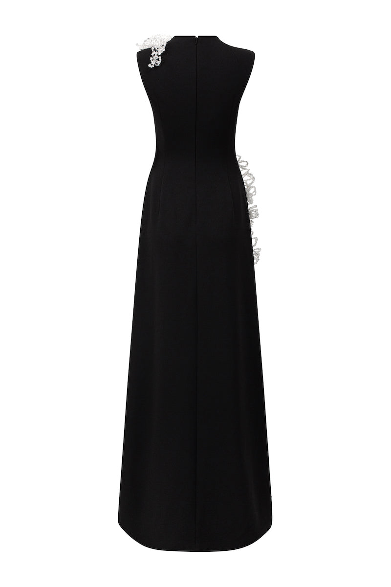 Black sleeveless poly crepe gown by L'Scarlett, featuring a flowing design and elegant neckline, perfect for formal occasions.