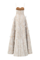 White L'SCARLETT A-line spaghetti strap gown with lace and gitter details, elegant evening dress with a flowing silhouette.
