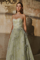 L'SCARLETT mint A-line spaghetti straps gown with glitter lace, elegant and flowing for formal occasions.