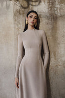 L'SCARLETT flared long-sleeve crystal beading gown with intricate detailing, elegant flowy silhouette, and luxurious fabric.