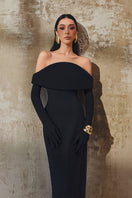 L'SCARLETT off-shoulder gown in flowing fabric, featuring a fitted bodice and elegant off-shoulder neckline, perfect for formal occasions.