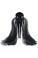 Black L'SCARLETT off-shoulder long-sleeve poly crepe jumpsuit, form-fitting design, displayed on a hanger.