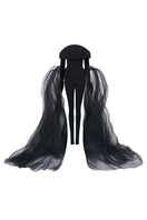 Black L'SCARLETT off-shoulder long-sleeve poly crepe jumpsuit with a form-fitting design, shown on a model.