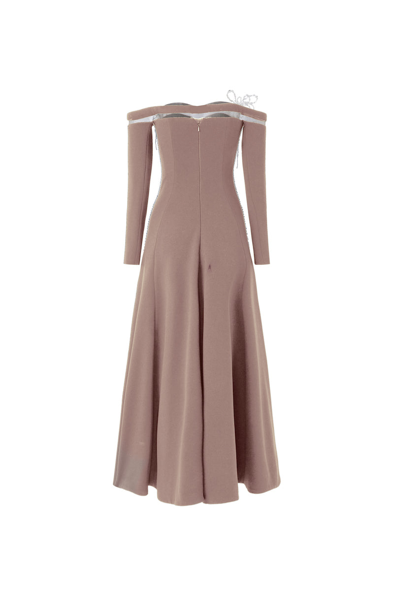 Beige off-shoulder long-sleeve poly crepe gown by L'SCARLETT, featuring elegant drape and fitted silhouette.
