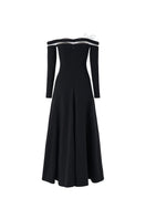 Black off-shoulder long-sleeve poly crepe gown by L'SCARLETT, featuring a flowing silhouette and elegant neckline.