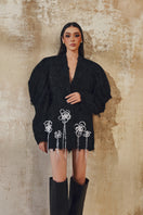 L'SCARLETT long-sleeve mini blazer dress in black, featuring structured lapels and tailored fit, shown on a model.