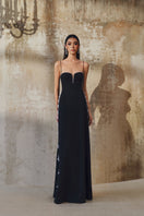 L'SCARLETT gown with shoulder straps, elegant evening dress featuring a flowing design and fitted bodice, in a soft fabric.