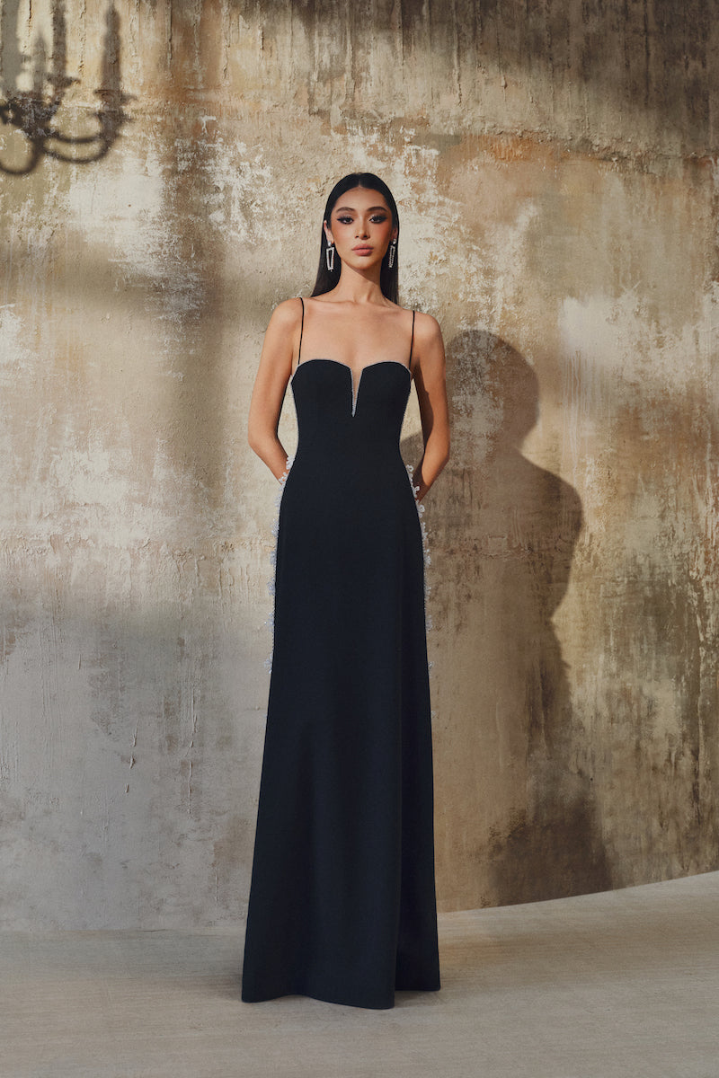L'SCARLETT gown with shoulder straps, elegant formal dress featuring a flowing design and stylish shoulder strap details.