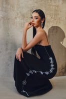 L'SCARLETT gown with shoulder straps, elegant evening dress featuring a flowing fabric and stylish design.