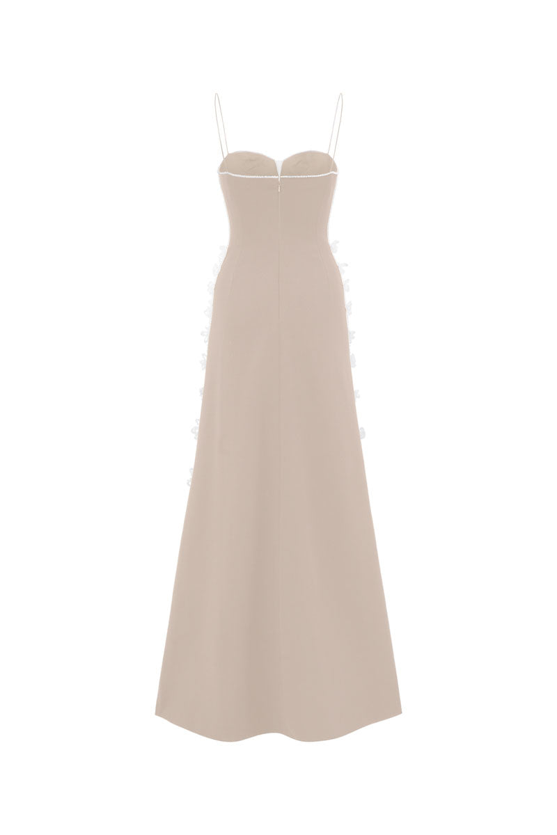 Beige L'SCARLETT gown with shoulder straps, elegant evening dress with flowing fabric and stylish design.