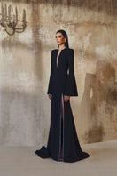 Long-sleeve mermaid gown by L'Scarlett, featuring fitted bodice and flared skirt, elegant evening dress in silky fabric.