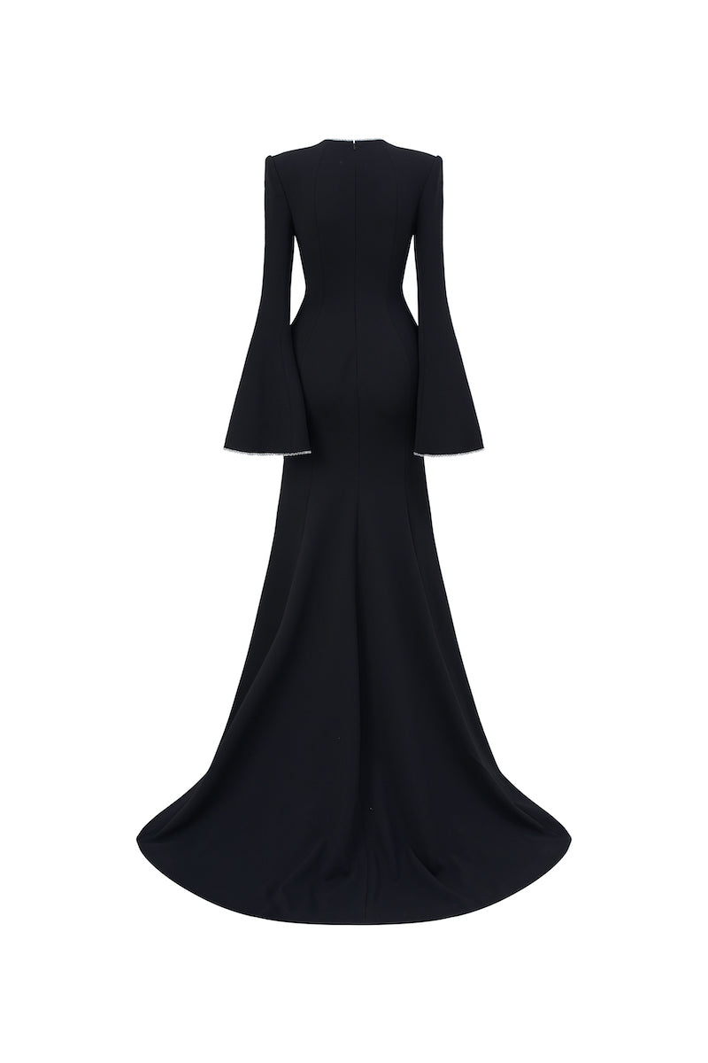 Black long-sleeve mermaid gown by L'Scarlett featuring fitted silhouette and elegant design, showcased on a dress form.