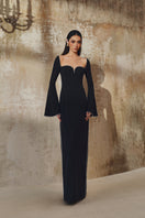 Long-sleeve gown by L'Scarlett featuring a flowing design, soft fabric, and elegant neckline, perfect for formal or casual wear.
