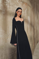 L'SCARLETT long-sleeve gown with elegant design, featuring soft fabric and a flowing silhouette, ideal for formal occasions.