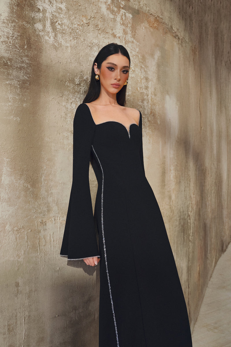 L'SCARLETT long-sleeve gown with elegant design, featuring soft fabric and a flowing silhouette, ideal for formal occasions.