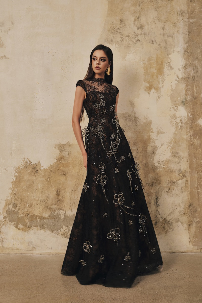 Black L'SCARLETT A-line high-neck short-sleeve maxi dress with 3D crystal floral details, elegant and flowing for formal occasions.