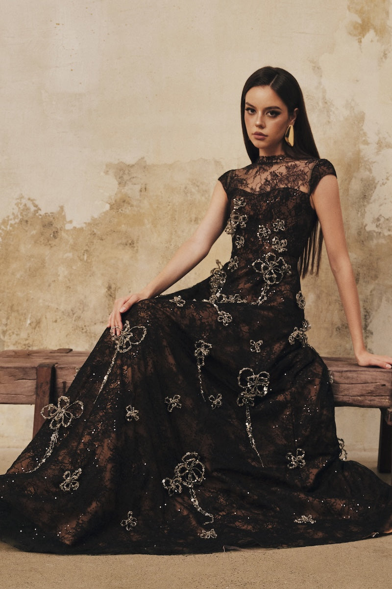 Black L'SCARLETT A-line high-neck short-sleeve maxi dress with 3D crystal floral embellishments, elegant evening style.