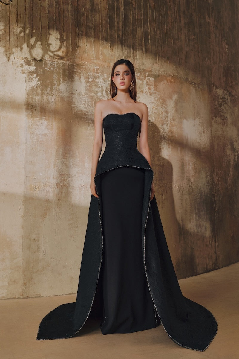 Black strapless floor-sweeping mullet overskirt maxi dress by L'SCARLETT, featuring a flowing hem and elegant design.