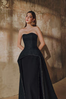 L'SCARLETT strapless floor-sweeping mullet overskirt gown with flowing fabric and elegant design, showcased in the image.