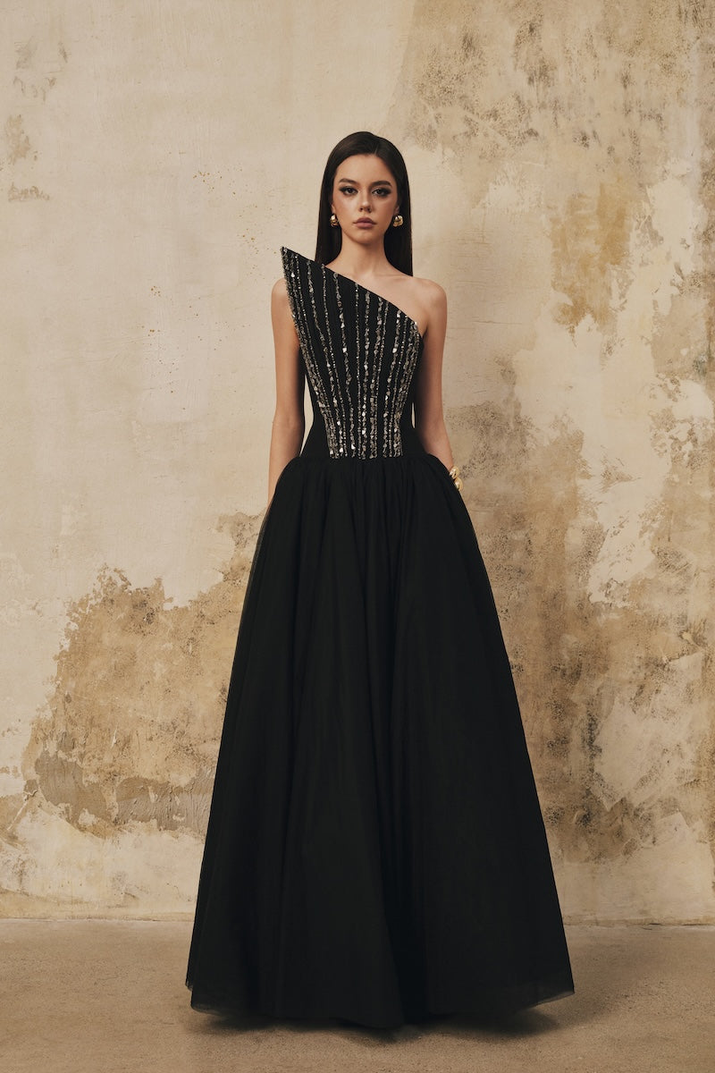 Black L'SCARLETT flared pointed-bustline evening gown with front draped crystal beading, elegant maxi dress for formal occasions.