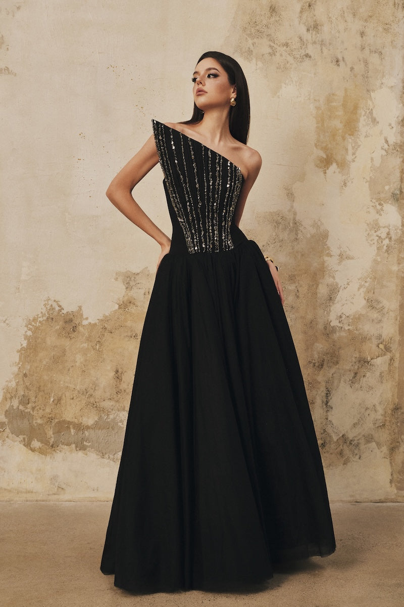Black L'SCARLETT flared pointed-bustline evening gown with front draped crystal beading and elegant maxi dress design.