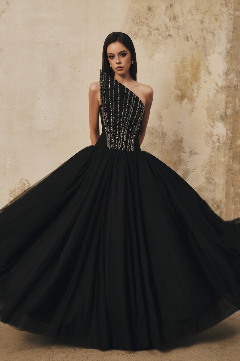 Black L'SCARLETT flared pointed-bustline evening gown with front draped crystal beading, maxi dress style, elegant and sophisticated.