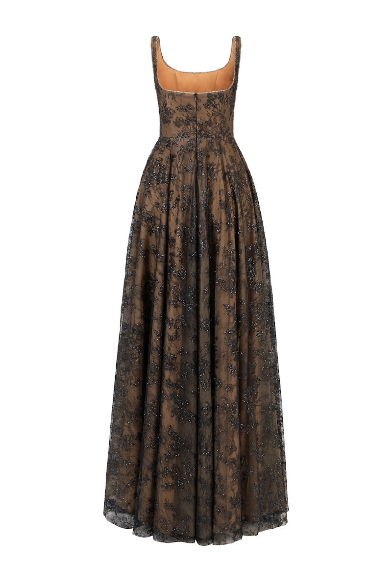 Black L'SCARLETT flared maxi dress with wide shoulder straps and crystal beading, shown from the back.