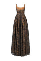 Black flared gown with wide shoulder straps and crystal beading by L'SCARLETT, shown from the back with flowing fabric.