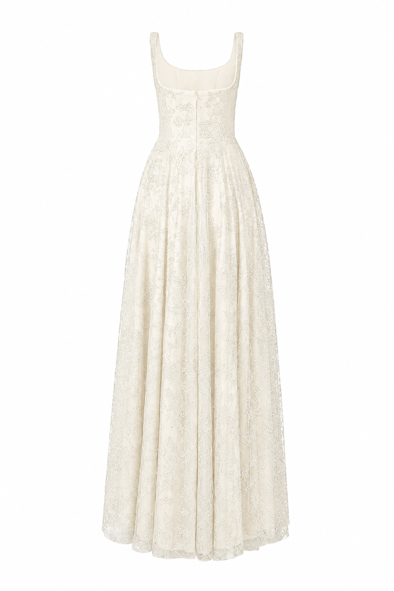 Off-white flared maxi dress with wide shoulder straps and crystal beading by L'SCARLETT, shown from the back.