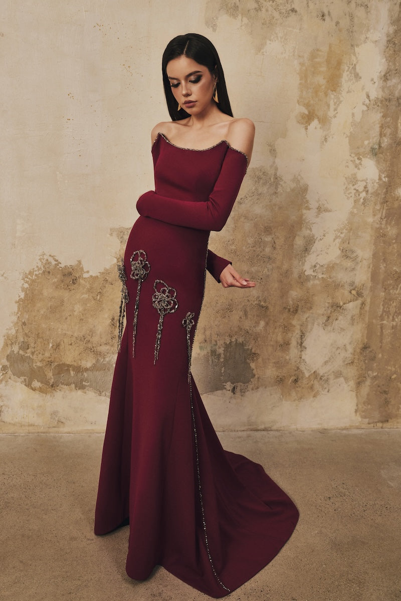 L'SCARLETT burgundy fitted maxi dress with softly curved neckline and 3D crystal floral embellishments, full-length evening gown