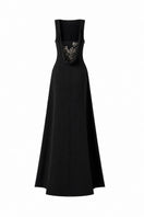 Black draped-back sleeveless maxi dress with 3D crystal floral details by L'SCARLETT, showcasing elegant flowing fabric and intricate embellishments.