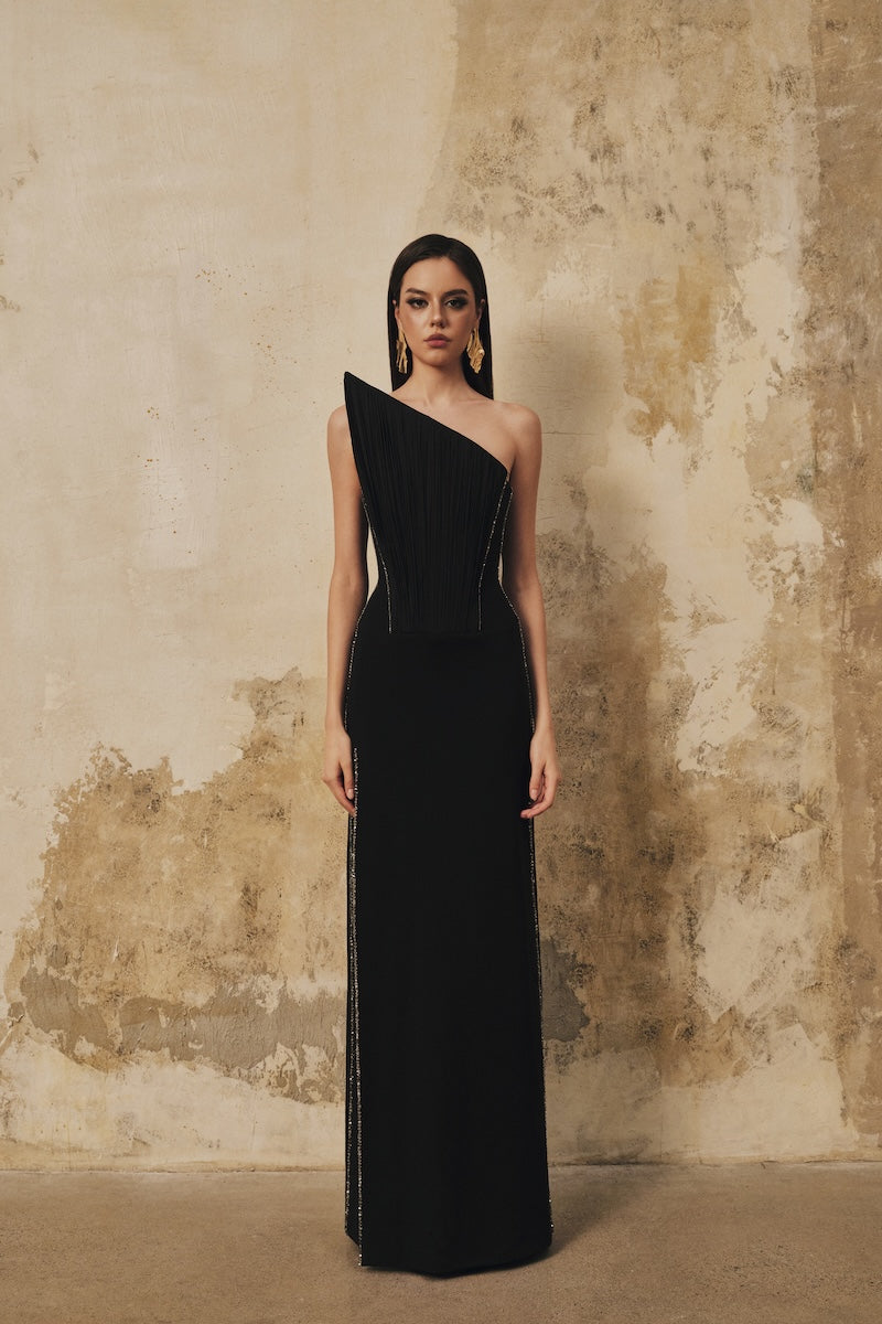 Black pointed-bustline crystal beaded front-slit maxi dress by L'SCARLETT, showcasing elegant design and intricate embellishments.
