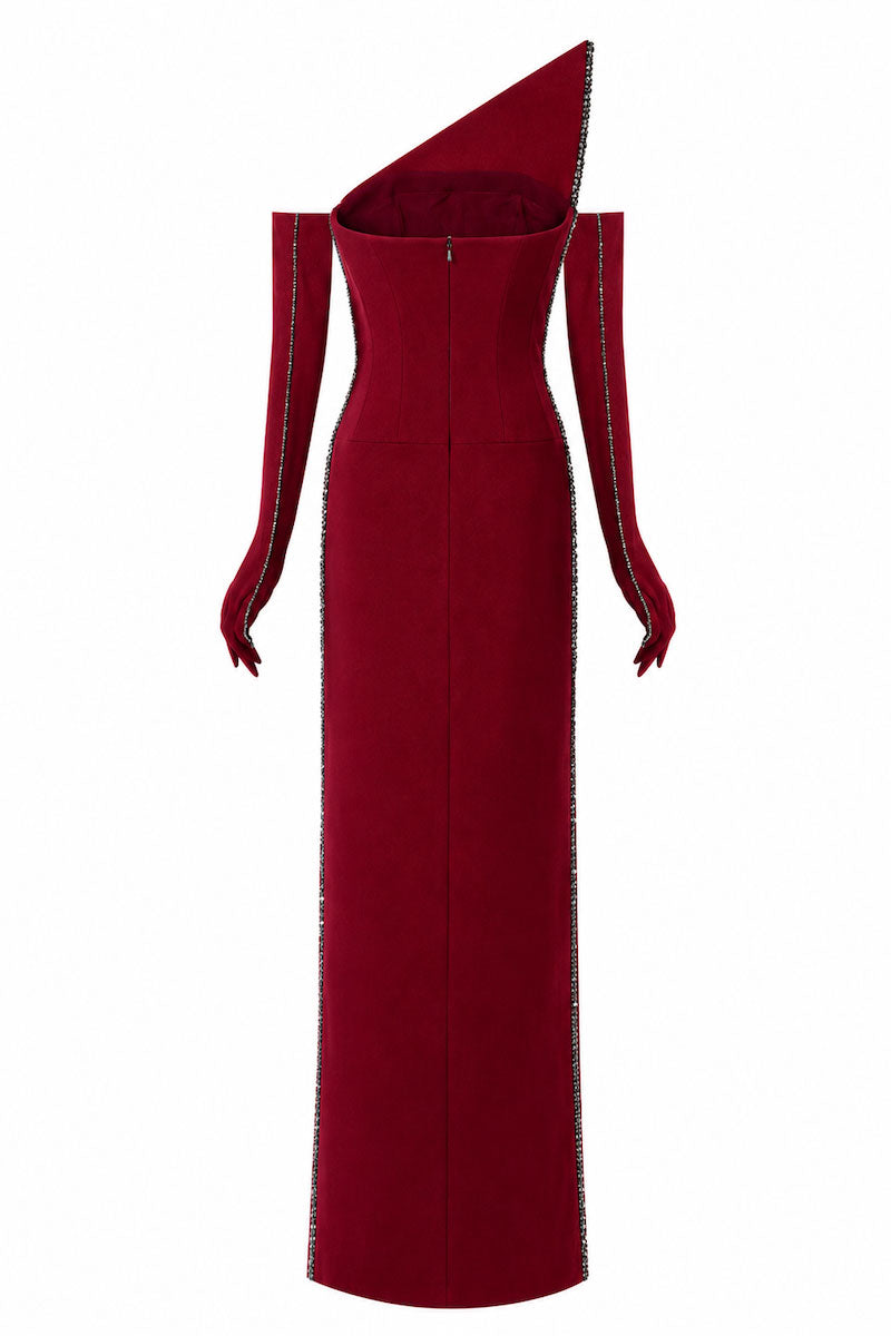 Elegant burgundy L'SCARLETT maxi dress with pointed bustline, crystal beading, and front slit, perfect for formal occasions.