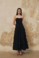 Black L'Scarlett A-line spaghetti-strap gown with crystal beading, elegant evening dress with a flowing silhouette.