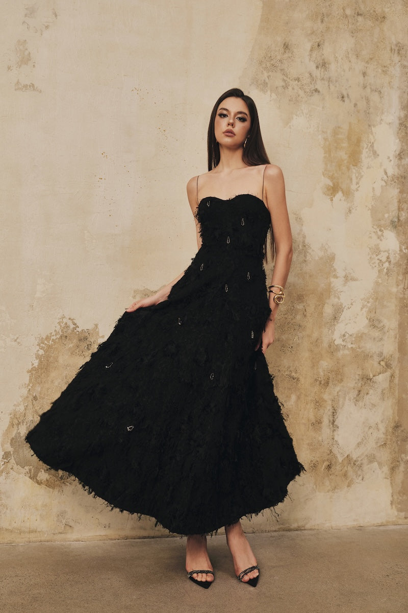 Black A-line spaghetti-strap midi dress by L'SCARLETT with crystal beading, perfect for elegant occasions.